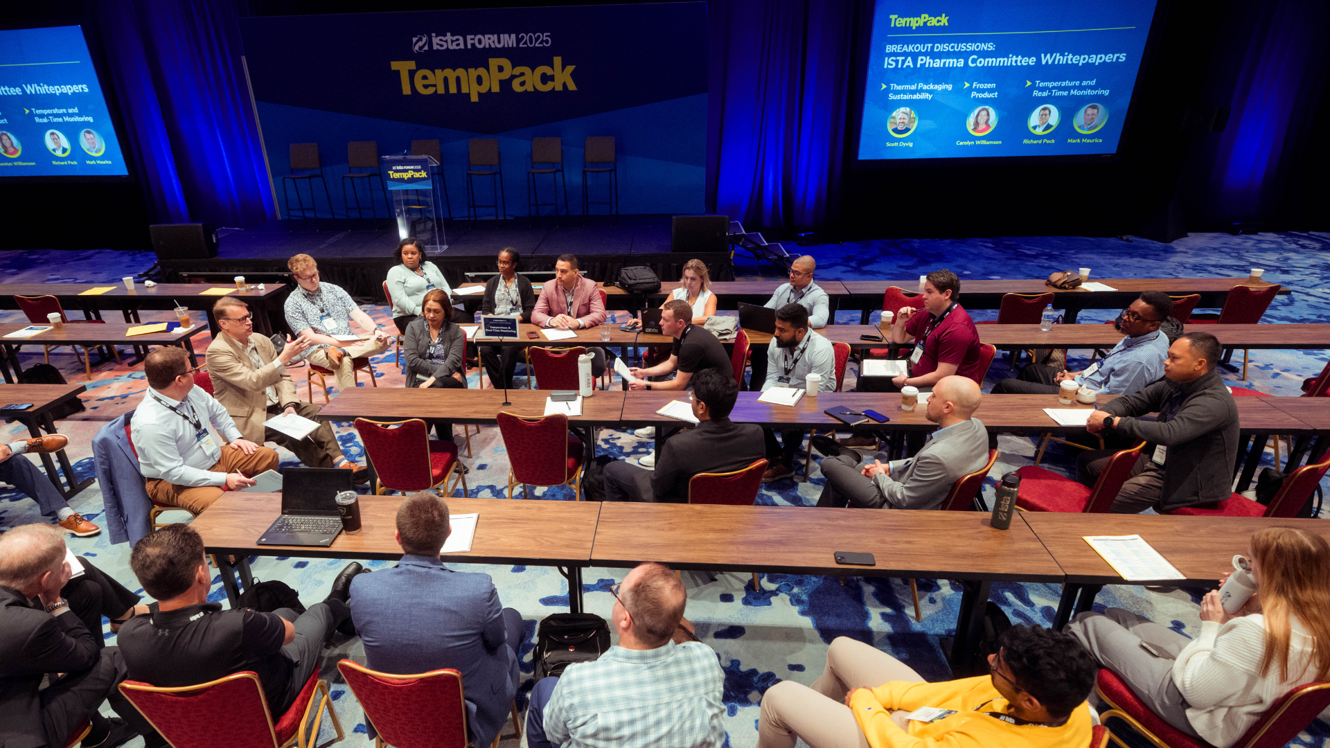 Attendee gathers name badge